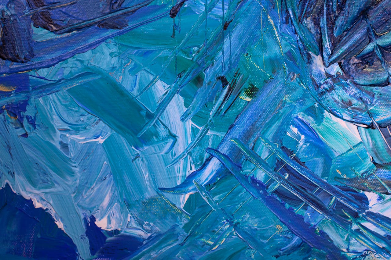 Dynamic blue abstract painting showcasing rich textures and hues, perfect for creative backgrounds.